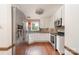 Bright kitchen with stainless steel appliances, white cabinetry, and a view of the outdoors at 652 Camrose Ne Cir, Concord, NC 28025