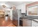 Kitchen with stainless steel appliances and view into adjacent living room at 652 Camrose Ne Cir, Concord, NC 28025