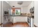 Well-lit kitchen featuring stainless steel appliances, white cabinetry, and stylish backsplash at 652 Camrose Ne Cir, Concord, NC 28025