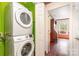 Convenient laundry area with stacked washer and dryer, and easy access to other rooms at 652 Camrose Ne Cir, Concord, NC 28025