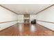 Spacious living room featuring hardwood floors, stone fireplace, and plenty of natural light at 652 Camrose Ne Cir, Concord, NC 28025