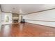 Bright living room features hardwood floors and a stone fireplace, perfect for cozy evenings at 652 Camrose Ne Cir, Concord, NC 28025