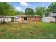The backyard includes a patio, a shed, a yard, and privacy trees at 6558 Covecreek Dr, Charlotte, NC 28215
