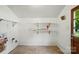 This is a basement or storage space with utility shelves and access door at 6558 Covecreek Dr, Charlotte, NC 28215