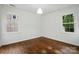 Bright bedroom with hardwood floors and large windows at 6558 Covecreek Dr, Charlotte, NC 28215