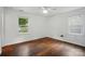 Bedroom with hardwood floors and two windows for natural light at 6558 Covecreek Dr, Charlotte, NC 28215
