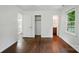 Bright bedroom with hardwood floors, closet, and bathroom access at 6558 Covecreek Dr, Charlotte, NC 28215