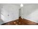 This is a bedroom with wood floors and a large closet at 6558 Covecreek Dr, Charlotte, NC 28215