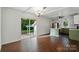 An open kitchen features a stainless fridge, island, and sliding doors to the backyard at 6558 Covecreek Dr, Charlotte, NC 28215