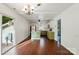 An eat-in kitchen features stainless steel appliances, island, and backyard views at 6558 Covecreek Dr, Charlotte, NC 28215