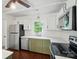 Stainless steel appliances, white subway tile, and hardwood floors in a modern kitchen at 6558 Covecreek Dr, Charlotte, NC 28215