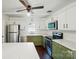 Stainless steel appliances, white subway tile and cabinetry in an updated kitchen at 6558 Covecreek Dr, Charlotte, NC 28215