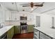 Bright kitchen with stainless steel appliances and an island for extra prep space at 6558 Covecreek Dr, Charlotte, NC 28215