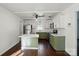 The kitchen is updated with stainless appliances, white countertops and hardwood floors at 6558 Covecreek Dr, Charlotte, NC 28215