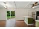 An open-concept space with an island looks out on a peaceful backyard at 6558 Covecreek Dr, Charlotte, NC 28215