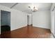 A living room with hardwood floors offers a seamless transition to the rest of the home at 6558 Covecreek Dr, Charlotte, NC 28215
