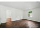 Bright living room featuring hardwood floors, natural light, and fresh paint for a modern touch at 6558 Covecreek Dr, Charlotte, NC 28215