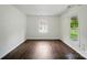 Bright living room featuring hardwood floors, natural light, and fresh paint for a modern touch at 6558 Covecreek Dr, Charlotte, NC 28215