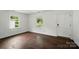 Bright living room featuring hardwood floors, natural light, and fresh paint for a modern touch at 6558 Covecreek Dr, Charlotte, NC 28215
