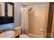 Bathroom featuring wood vanity, rainfall shower, and patterned shower curtain at 7041 Kays Dr, York, SC 29745