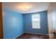 Bedroom with hardwood floors, neutral paint, natural lighting, and a closet at 7041 Kays Dr, York, SC 29745