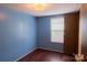 Bedroom with hardwood floors, neutral paint, natural lighting, and a closet at 7041 Kays Dr, York, SC 29745