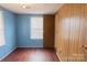 Bedroom with hardwood floors, neutral paint, natural lighting, and a closet at 7041 Kays Dr, York, SC 29745