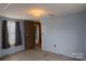 Cozy bedroom features plush carpet, neutral paint, natural lighting from window, and closet at 7041 Kays Dr, York, SC 29745