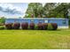 Charming one-story home featuring lush landscaping and a well-manicured lawn at 7041 Kays Dr, York, SC 29745