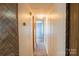 Hallway features wood paneling, overhead lighting, and access to other rooms at 7041 Kays Dr, York, SC 29745