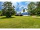 Exterior view of home featuring large yard and mature landscaping at 7041 Kays Dr, York, SC 29745