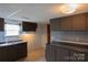 Functional kitchen featuring dark cabinets, ample counter space, and essential appliances at 7041 Kays Dr, York, SC 29745
