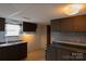 Functional kitchen featuring dark cabinets, ample counter space, and essential appliances at 7041 Kays Dr, York, SC 29745