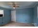 Bright living room with wood laminate flooring, neutral paint, ceiling fan, and ample natural light at 7041 Kays Dr, York, SC 29745
