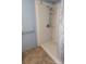 Bathroom shower featuring handheld showerhead, shelves for storage, and tiled flooring at 7041 Kays Dr, York, SC 29745