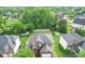 Aerial view of a beautiful home with a fenced backyard surrounded by lush greenery at 7642 Horseshoe Creek Dr, Huntersville, NC 28078
