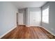 Bedroom with hardwood flooring, neutral paint, closet, and natural light at 7642 Horseshoe Creek Dr, Huntersville, NC 28078