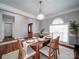 Inviting dining room featuring hardwood floors, chandelier, and natural light at 7642 Horseshoe Creek Dr, Huntersville, NC 28078
