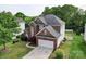 Aerial view of a well-maintained two-story home with lush green lawn at 7642 Horseshoe Creek Dr, Huntersville, NC 28078