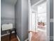 Practical laundry room includes a utility sink and doorway to a dining and living space at 7642 Horseshoe Creek Dr, Huntersville, NC 28078