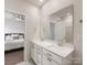 Modern bathroom featuring double sinks, a large mirror, and ample counter space for convenience at 7642 Porrera St, Charlotte, NC 28214