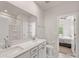 Well-lit bathroom with double sinks, a toilet, and a shower over tub combination for added functionality at 7642 Porrera St, Charlotte, NC 28214
