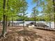 Picturesque boat dock featuring multiple slips and easy lake access, ideal for boating enthusiasts and water activities at 7642 Porrera St, Charlotte, NC 28214