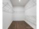 Walk-in closet with wire shelving and hardwood floors for organized storage at 7642 Porrera St, Charlotte, NC 28214