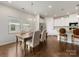 Light-filled dining area adjacent to the kitchen, perfect for Gathering meals and gatherings at 7642 Porrera St, Charlotte, NC 28214