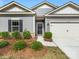 Close-up of this home's front entrance and two-car garage at 7642 Porrera St, Charlotte, NC 28214