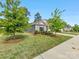 Landscaped corner lot with mature trees framing this charming single-story home at 7642 Porrera St, Charlotte, NC 28214