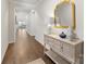 Inviting foyer with wood floors, console table, decor, and a view into the living area at 7642 Porrera St, Charlotte, NC 28214