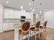 Bright kitchen with a spacious island, pendant lights, and modern appliances at 7642 Porrera St, Charlotte, NC 28214