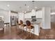 Gourmet kitchen featuring a center island with seating and pendant lighting at 7642 Porrera St, Charlotte, NC 28214